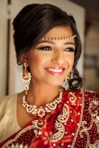 Bengali Bridesmaid wearing traditional attire and makeup with jewelry.