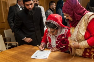 Nikah form being signed by a Bengali Bride on her wedding day.