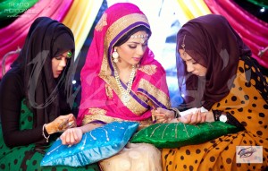Asian Bride getting Henna applied on her wedding day