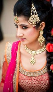Indian or Pakistani bride showing off her hair style on wedding day
