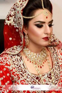 An Asian bride from UK with red themed Asian Bridal Makeup and Traditional Red Wedding Dress